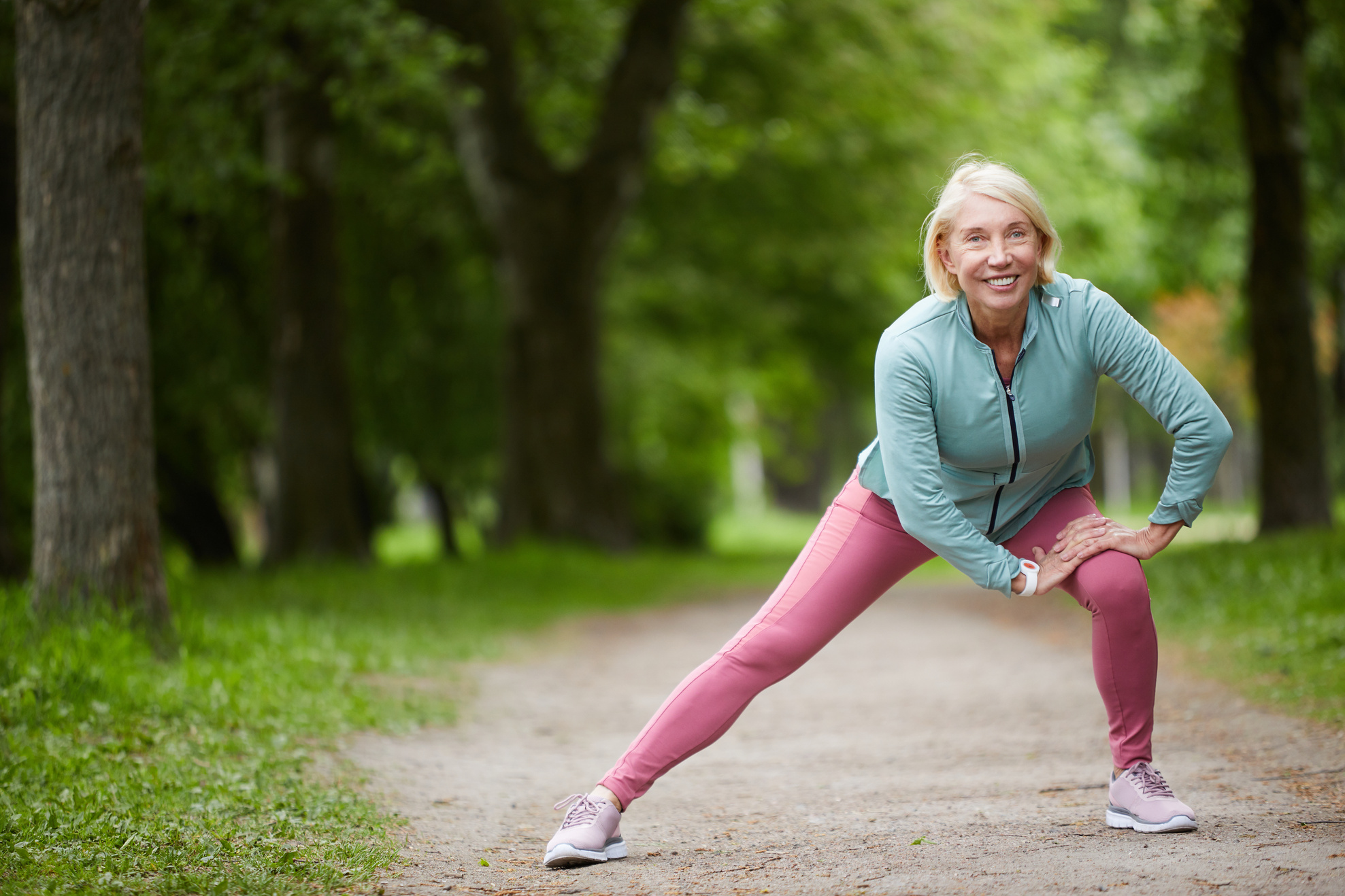 Old Woman Stretching Leg Outdoor